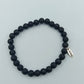 Elastisches Lava Stein Armband in Schwarz mit Anhänger von enso