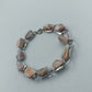 Elegantes Armband mit marmorierten Steinelementen in Rosé Creme Silberfarben