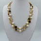 Elegante Perlenkette goldfarben mit schwarzen und klaren Steinen Vintage Stil