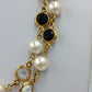 Elegante Perlenkette goldfarben mit schwarzen und klaren Steinen Vintage Stil