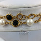 Elegante Perlenkette goldfarben mit schwarzen und klaren Steinen Vintage Stil