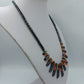 Ausdrucksstarke Statement Kette Hämatit Look mit Koralle Design modern