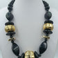 Statement Kette Schwarz Gold große Perlen  Design Elemente