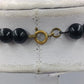 Statement Kette Schwarz Gold große Perlen  Design Elemente