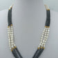 Mehrreihige Perlenkette schwarz weiß gold 43 cm elegant
