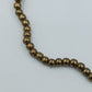 Goldfarbenes Perlenarmband elastisch schlicht elegant