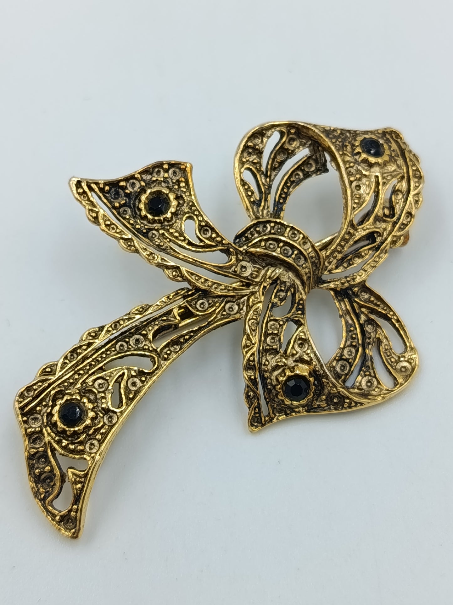Vintage Brosche Schleife Goldfarben mit dunklen Steinen