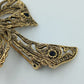 Vintage Brosche Schleife Goldfarben mit dunklen Steinen