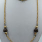 Lange goldfarbene Kette mit braunen Perlen – Vintage Look