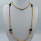 Lange goldfarbene Kette mit braunen Perlen – Vintage Look