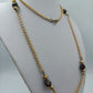 Lange goldfarbene Kette mit braunen Perlen – Vintage Look