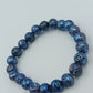 Elastisches Armband mit blauen Lavastein-Perlen – schimmernd