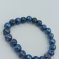 Elastisches Armband mit blauen Lavastein-Perlen – schimmernd