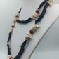 Boho Kette mit Muscheln und schwarzen Scheibenperlen