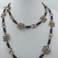 Lange Boho Kette mit Drahtblumen und Kupfer-Optik Handarbeitsstil
