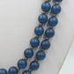 Lange doppelte Perlenkette in Blau mit Zierelement – 53 cm