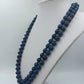 Lange doppelte Perlenkette in Blau mit Zierelement – 53 cm