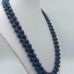 Lange doppelte Perlenkette in Blau mit Zierelement – 53 cm