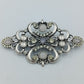 Vintage Brosche im Barockstil mit Strass Cabochons – silberfarben