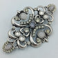 Vintage Brosche im Barockstil mit Strass Cabochons – silberfarben