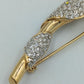 Elegante Vintage Brosche in Goldoptik mit Strass – geschwungenes Design