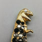 Modische T-Rex Dinosaurier Brosche in Goldoptik