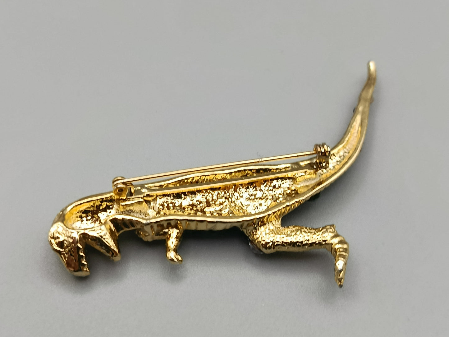Modische T-Rex Dinosaurier Brosche in Goldoptik