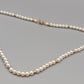 Klassische Perlen Kette mit Goldakzenten