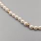 Klassische Perlen Kette mit Goldakzenten