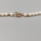Klassische Perlen Kette mit Goldakzenten