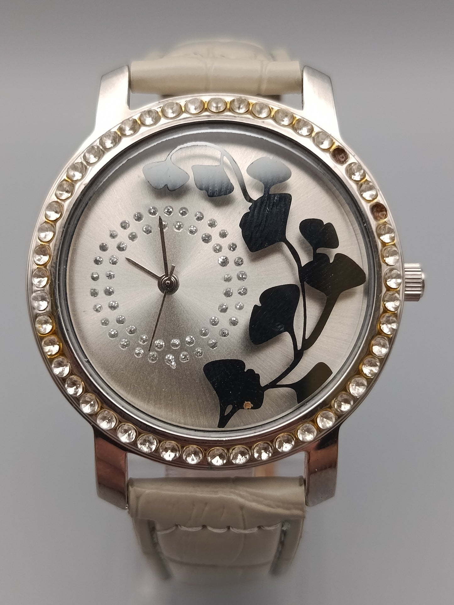 Moderne Damen Uhr mit Strasslünette und floralem Zifferblatt