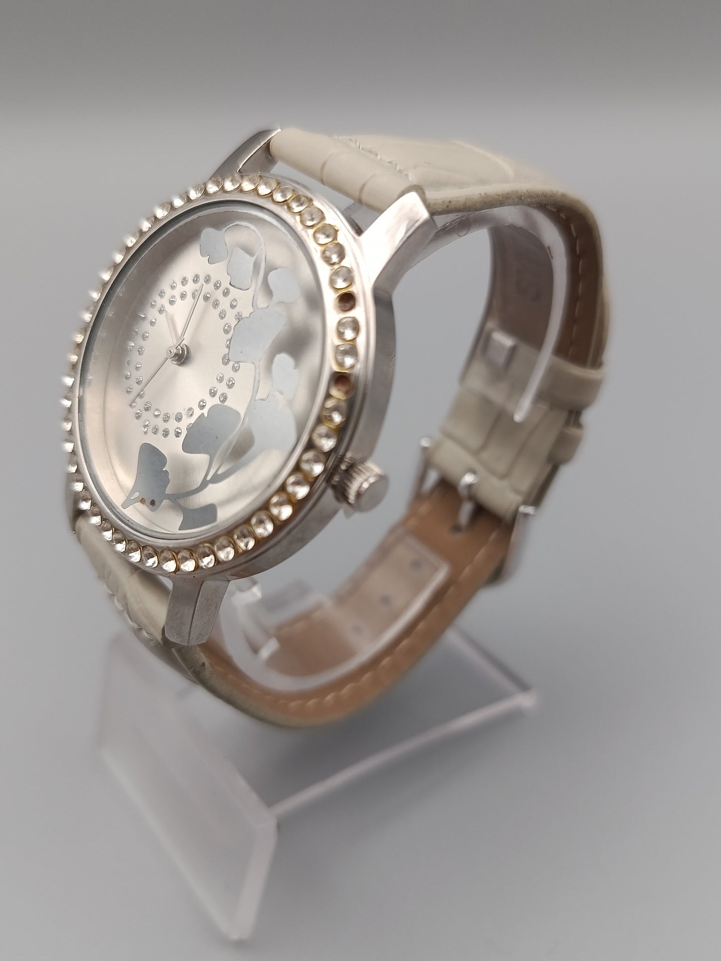 Moderne Damen Uhr mit Strasslünette und floralem Zifferblatt