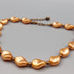 Elegante apricotfarbene Perlen Kette Barock-Stil