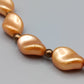 Elegante apricotfarbene Perlen Kette Barock-Stil