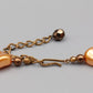 Elegante apricotfarbene Perlen Kette Barock-Stil