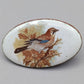 Vintage Emaille Brosche – Ovaler Pin mit Vogel Motiv