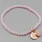 Elegantes Rosenquarz Perlenarmband in Rosa mit Anhängern