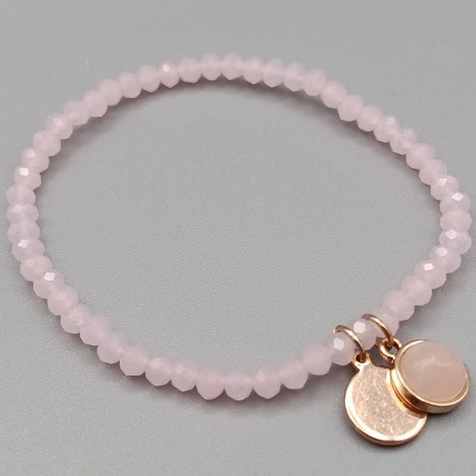Elegantes Rosenquarz Perlenarmband in Rosa mit Anhängern