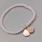 Elegantes Rosenquarz Perlenarmband in Rosa mit Anhängern
