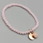 Elegantes Rosenquarz Perlenarmband in Rosa mit Anhängern