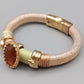 Stilvolles Damen Armband in Gold-Optik mit braunem Stein