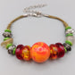 Bunte Perlen Kette mit auffälliger Center-Bead – Boho Stil