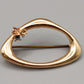 Elegante goldfarbene Brosche mit Strasssteinen Vintage