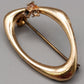 Elegante goldfarbene Brosche mit Strasssteinen Vintage