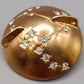 Goldfarbene Brosche mit Strasssteinen Vintage