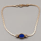 Elegantes Avon Damen Armband – Goldoptik mit blauem Cabochon