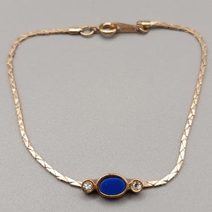 Elegantes Avon Damen Armband – Goldoptik mit blauem Cabochon