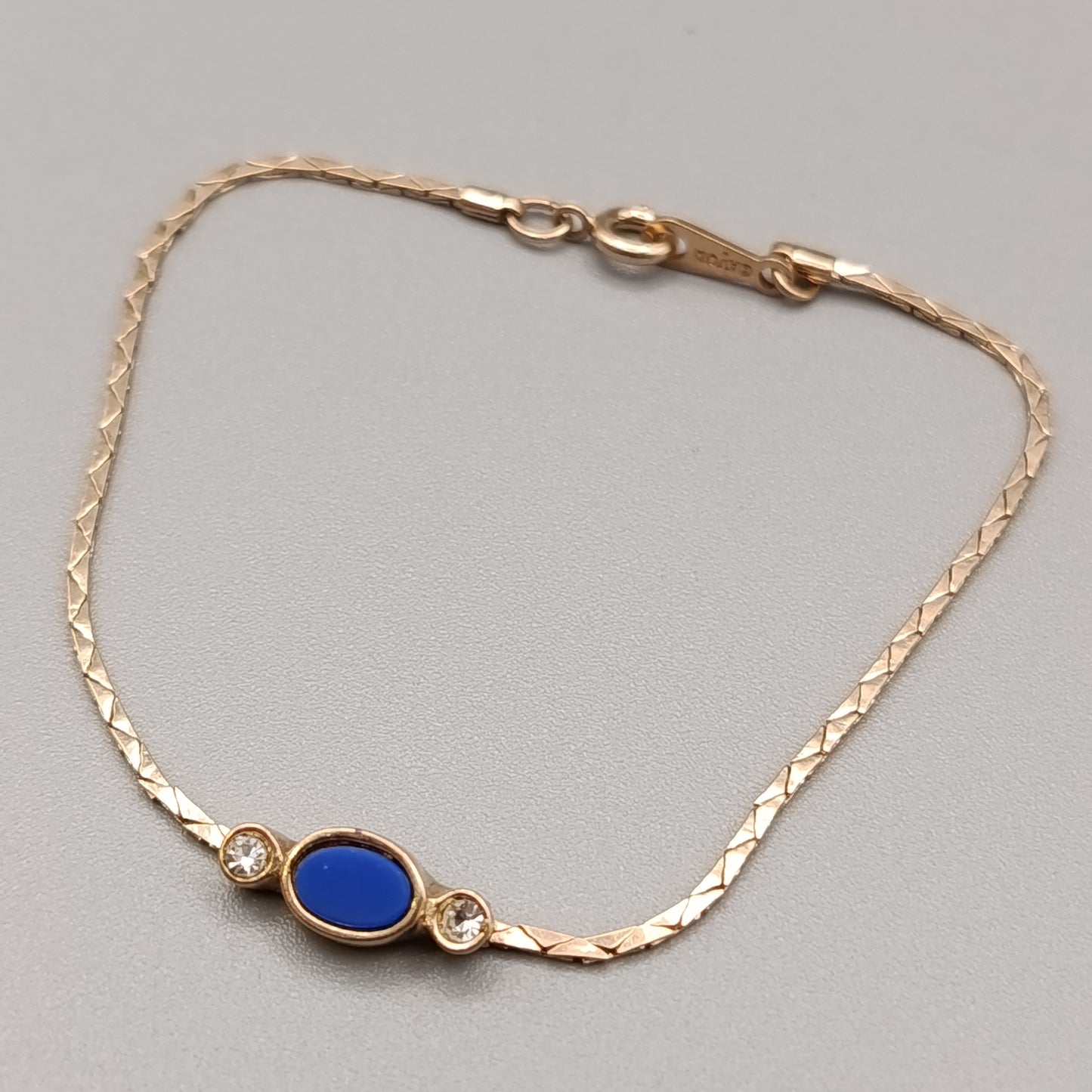 Elegantes Avon Damen Armband – Goldoptik mit blauem Cabochon