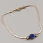 Elegantes Avon Damen Armband – Goldoptik mit blauem Cabochon