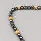 Schicke Hämatit Kette – Elegant mit goldenen Akzenten